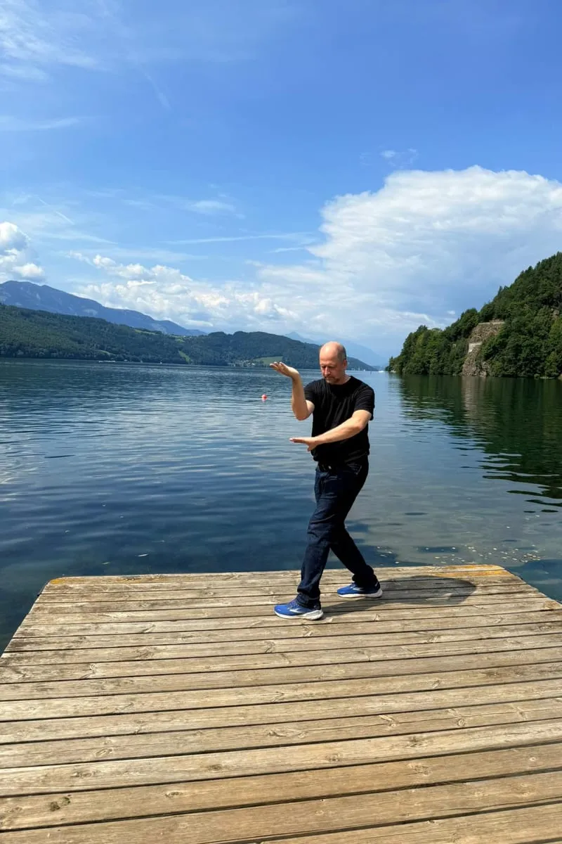 Wuji Quan movement on a jetty by the lake — flowing practice in nature